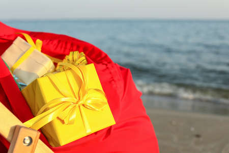 Santa Claus bag with gifts on beach, closeupの写真素材