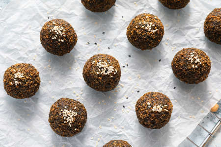 Tasty falafel balls on light background