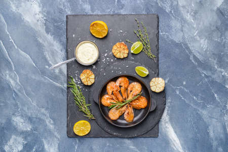 Plate with tasty shrimps on color background