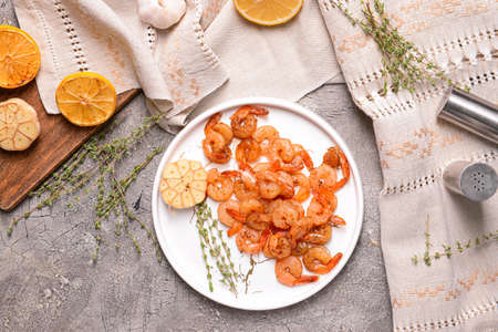 Plate with tasty shrimps on gray backgroundの写真素材