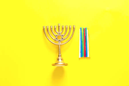 Menorah for Hanukkah on color backgroundの写真素材