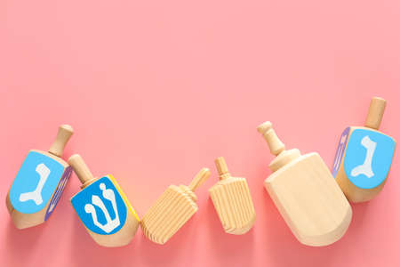 Dreidels for Hanukkah on color backgroundの写真素材