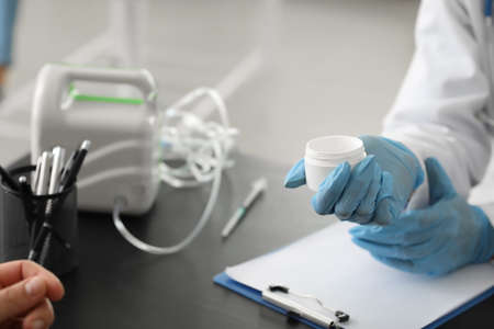 Allergist giving remedy to patient in clinic