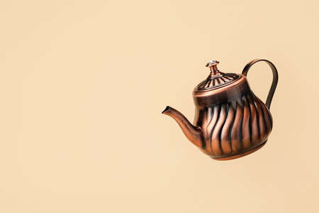 Stylish teapot on color backgroundの写真素材
