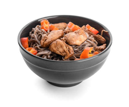 Bowl with tasty soba noodles and meat on white background