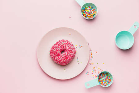 Composition with sweet donut on color backgroundの写真素材