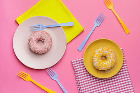 Composition with sweet donuts on color backgroundの写真素材