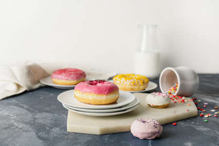 Composition with sweet donuts on tableの写真素材