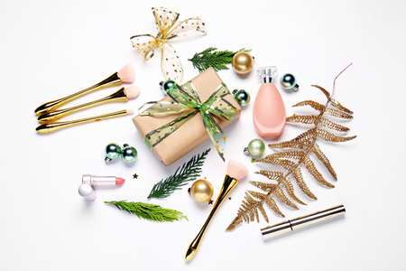 Christmas composition with cosmetics on white backgroundの写真素材