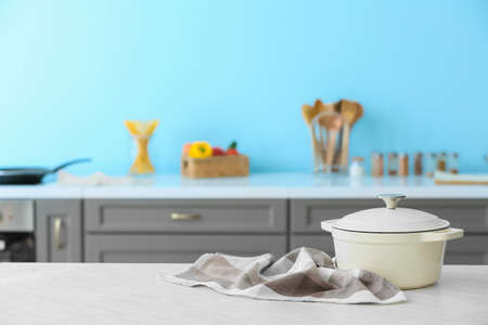 Cooking pot on table in modern kitchenの写真素材