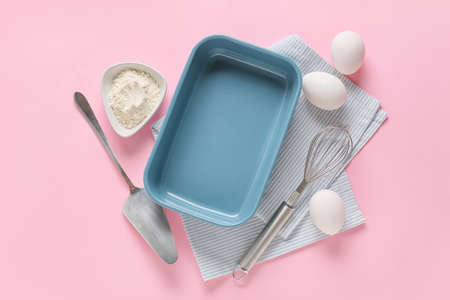 Set of kitchen utensils and ingredients for preparing bakery on color backgroundの写真素材