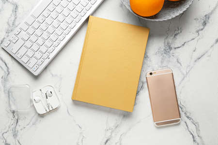 Blank book and modern gadgets on light backgroundの写真素材