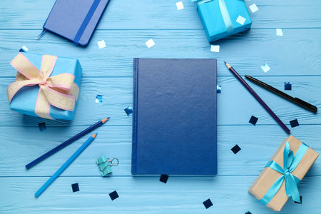 Christmas composition with blank book on color wooden backgroundの写真素材