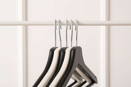 Rack with clothes hangers on white backgroundの写真素材
