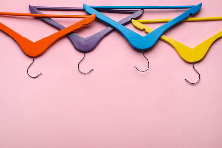 Clothes hangers on color backgroundの写真素材