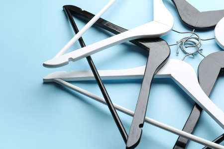 Composition with clothes hangers on color backgroundの写真素材