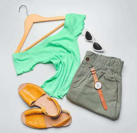 Clothes, hanger and accessories on light backgroundの写真素材