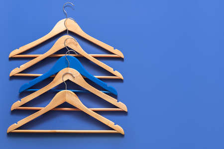 Clothes hangers on color backgroundの写真素材