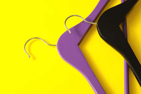 Clothes hangers on color backgroundの写真素材