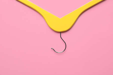 Clothes hanger on color backgroundの写真素材