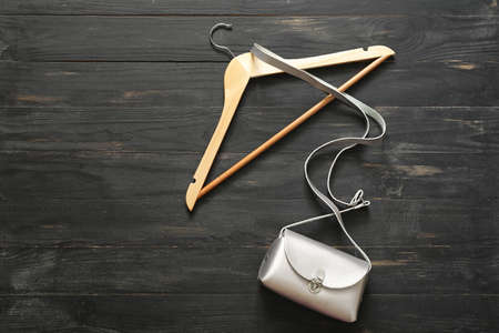 Clothes hanger and bag on dark backgroundの写真素材