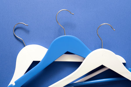 Clothes hangers on color backgroundの写真素材