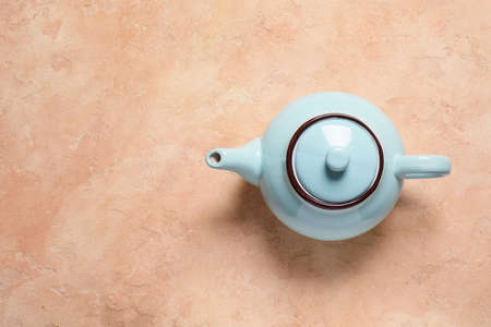 Teapot on table, top viewの写真素材