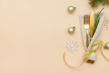 Composition with cutlery for Christmas table setting on color backgroundの写真素材