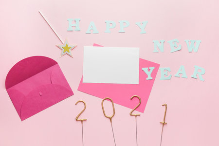 Beautiful New Year composition with blank card on color backgroundの写真素材