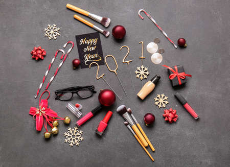 New Year composition with makeup cosmetics on dark backgroundの写真素材