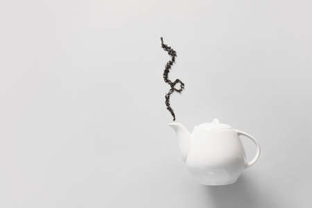 Composition with teapot on light backgroundの写真素材