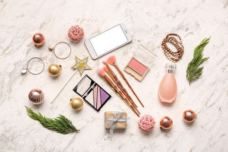 New Year composition with makeup cosmetics on white background