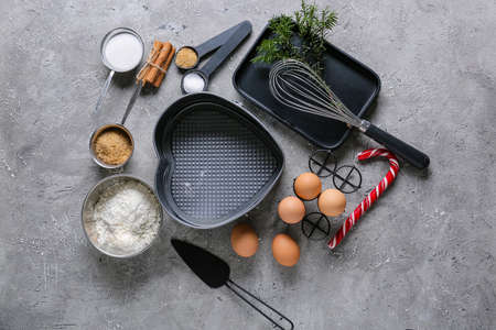 Ingredients for Christmas bakery and kitchen utensils on grunge backgroundの写真素材