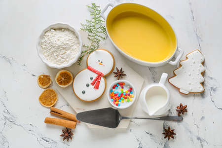 Ingredients for Christmas bakery and kitchen utensils on white background