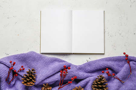 Blank book with Christmas decor on white background