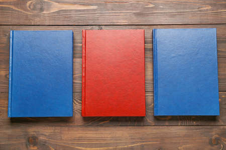 Blank books on wooden background