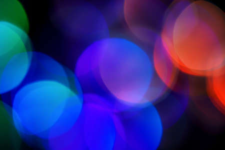 Dark abstract background with blurred lightsの写真素材