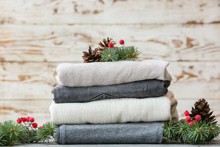 Stylish Christmas clothes on tableの写真素材