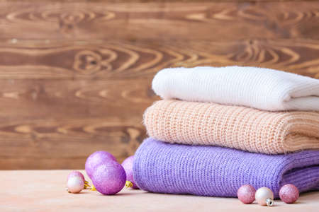 Stylish Christmas clothes on tableの写真素材