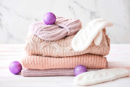 Stylish Christmas clothes on tableの写真素材