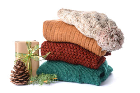 Stylish Christmas clothes with gift on white backgroundの写真素材