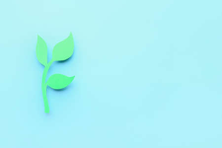 Paper olive branch on color background. International Day of Peace