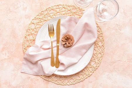 Beautiful Christmas table setting on color backgroundの写真素材