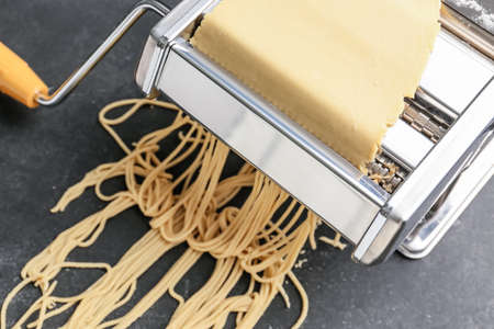 Pasta maker with dough, closeupの写真素材