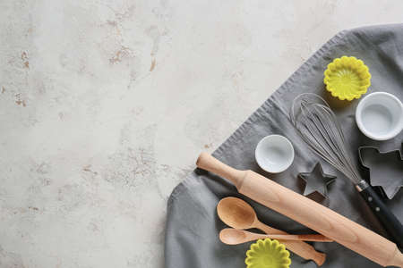 Set of kitchen utensils for bakery on gray background
