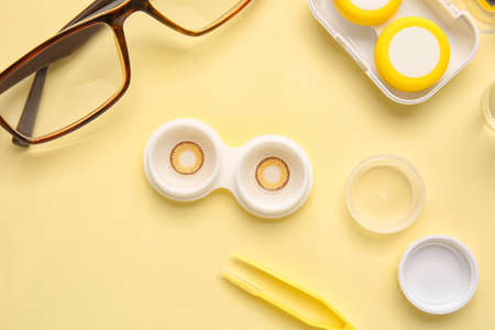 Composition with contact lenses and accessories on color backgroundの写真素材