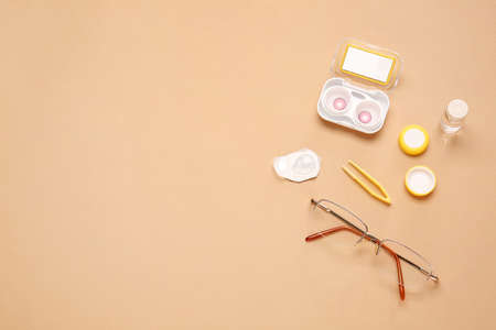 Composition with contact lenses and accessories on color backgroundの写真素材