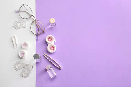 Composition with contact lenses and accessories on color background
