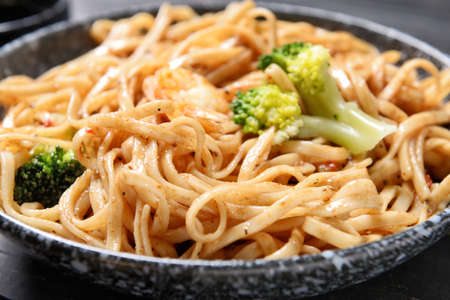 Plate with tasty noodles and seafood, closeupの写真素材