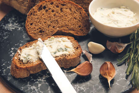 Slices of fresh bread with garlic butter, closeupの写真素材